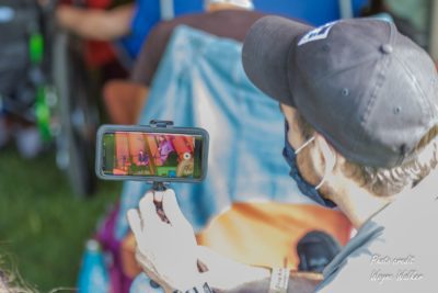 looking at the festival on a smartphone