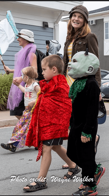People in the Deep Roots Music Festival parade