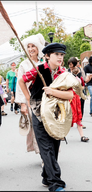 People in the Deep Roots Music Festival parade