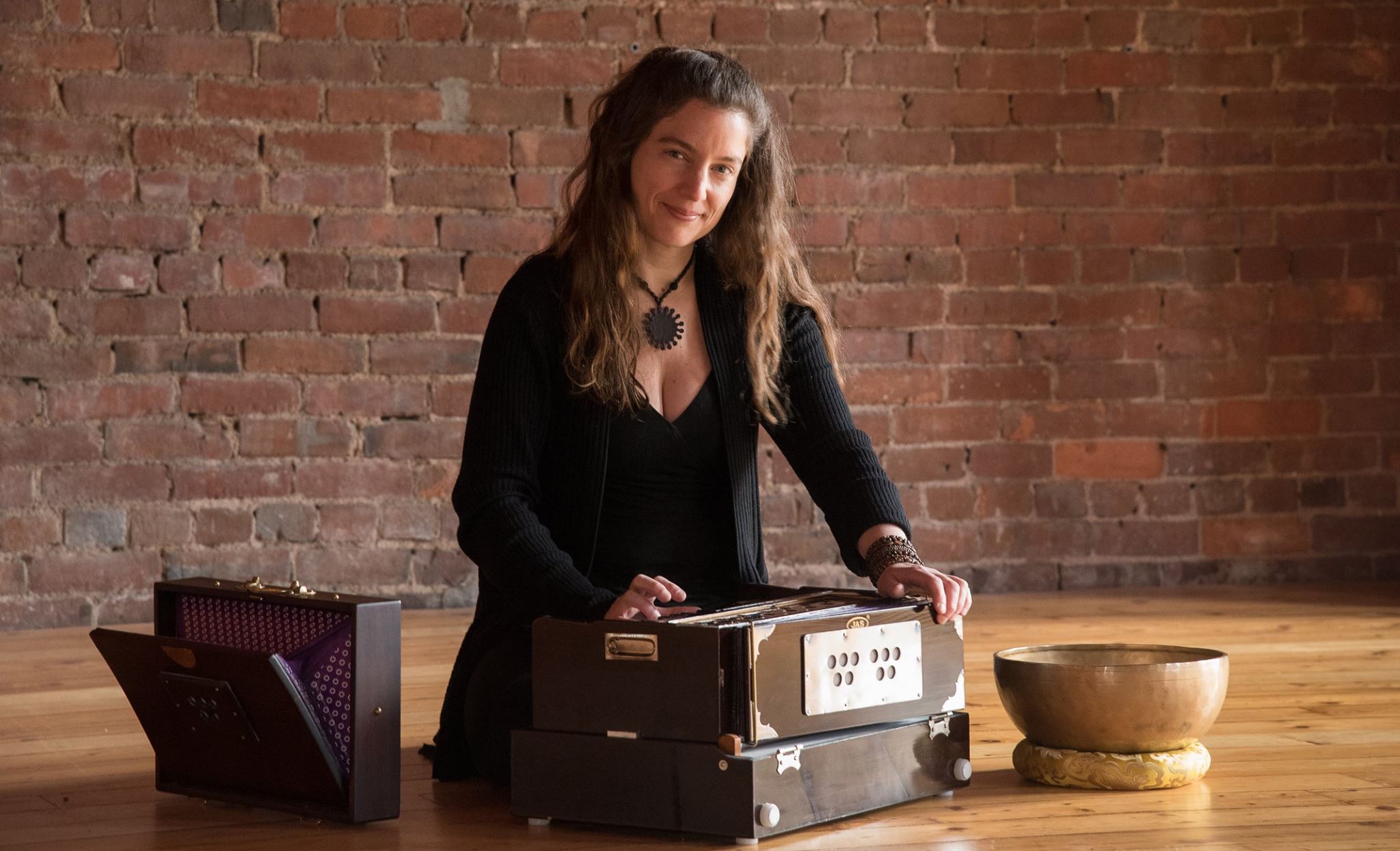 Heidi Kalyani playing harmonium